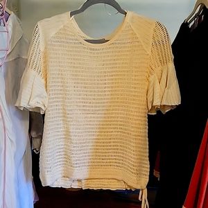 Cute Free people  crocheted top in cream color.